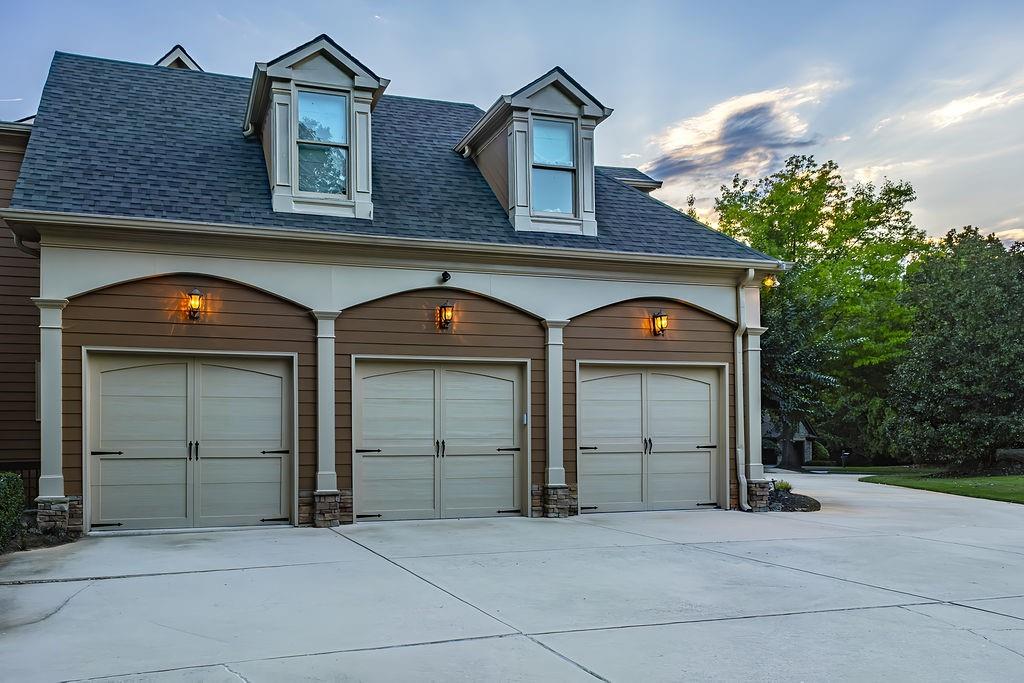 6225 Random Winds Bluff Gainesville, GA 30506 - Photo 4 of 96 a front view of a house with a yard and garage