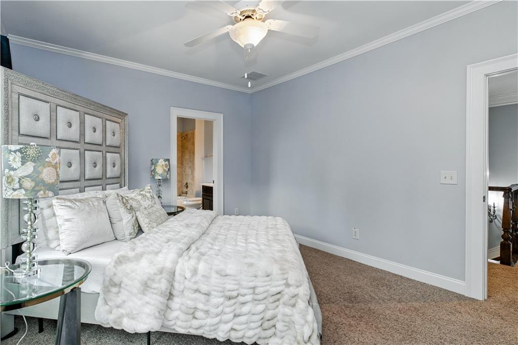 6225 Random Winds Bluff Gainesville, GA 30506 - Photo 46 of 96 a bedroom with a bed and a chandelier