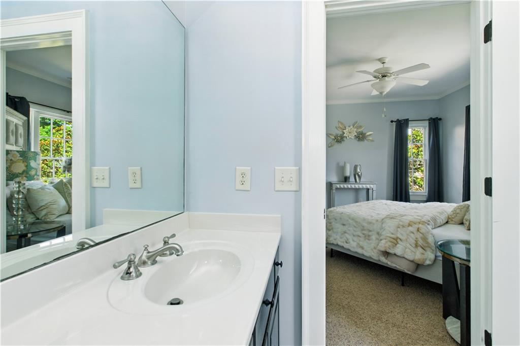 6225 Random Winds Bluff Gainesville, GA 30506 - Photo 55 of 96 a en suite bathroom with a granite countertop sink and a mirror