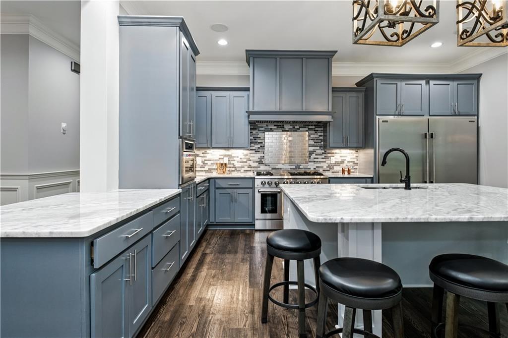 6225 Random Winds Bluff Gainesville, GA 30506 - Photo 66 of 96 a kitchen with granite countertop counter space a sink appliances and cabinets