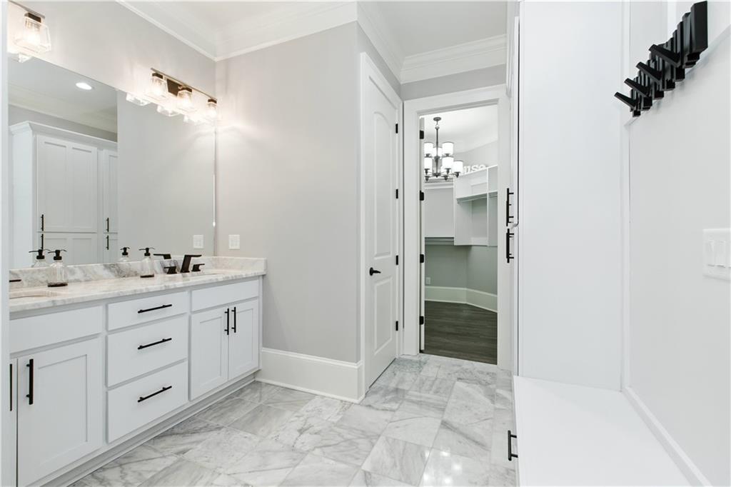 6225 Random Winds Bluff Gainesville, GA 30506 - Photo 77 of 96 a bathroom with a double vanity sink mirror and shower