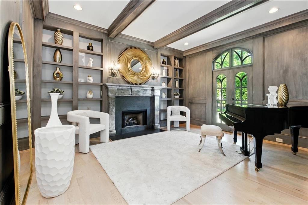 6225 Random Winds Bluff Gainesville, GA 30506 - Photo 10 of 96 a living room with furniture a fireplace and a large window
