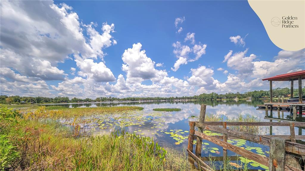 Dunham Avenue Interlachen, FL 32148 - Photo 20 of 28 a view of a lake with a building in the background