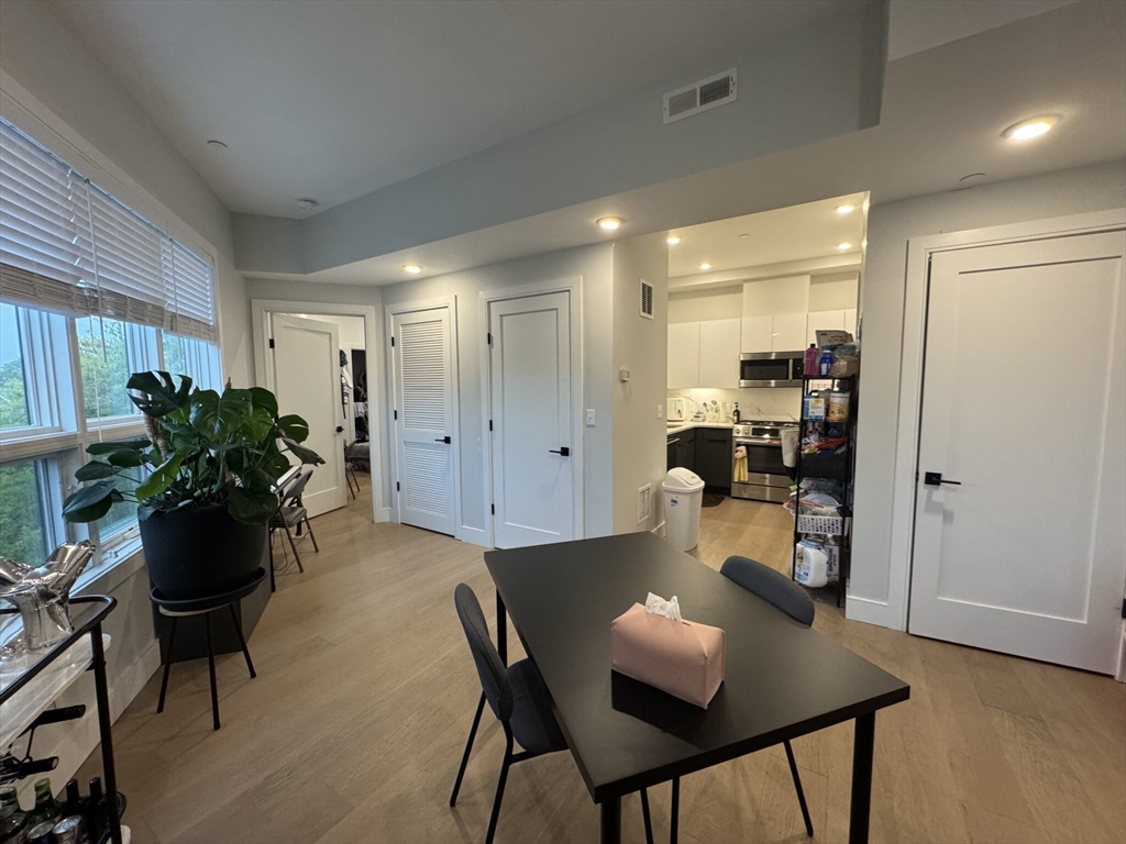 33 Ward Street, Unit 12 Boston, MA 02127 - Photo 2 of 19 a dining room with furniture and wooden floor