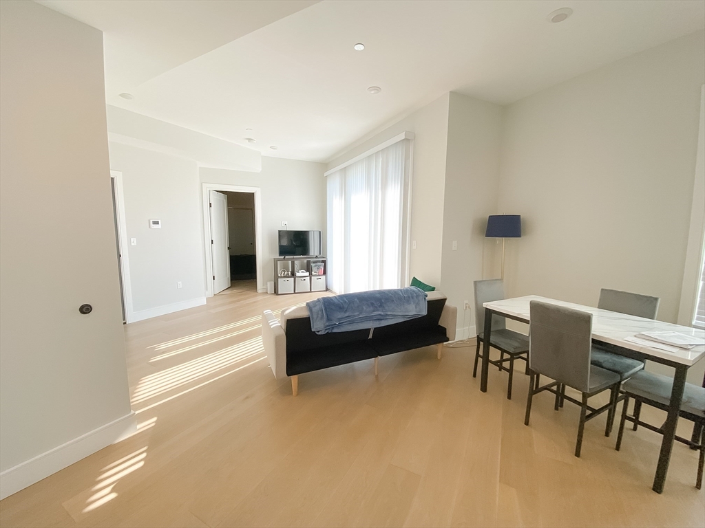 33 Ward Street, Unit 12 Boston, MA 02127 - Photo 3 of 19 a living room with furniture and a large window