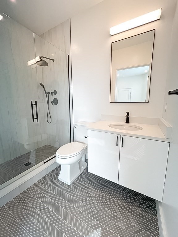 33 Ward Street, Unit 12 Boston, MA 02127 - Photo 6 of 19 a bathroom with a toilet sink and mirror