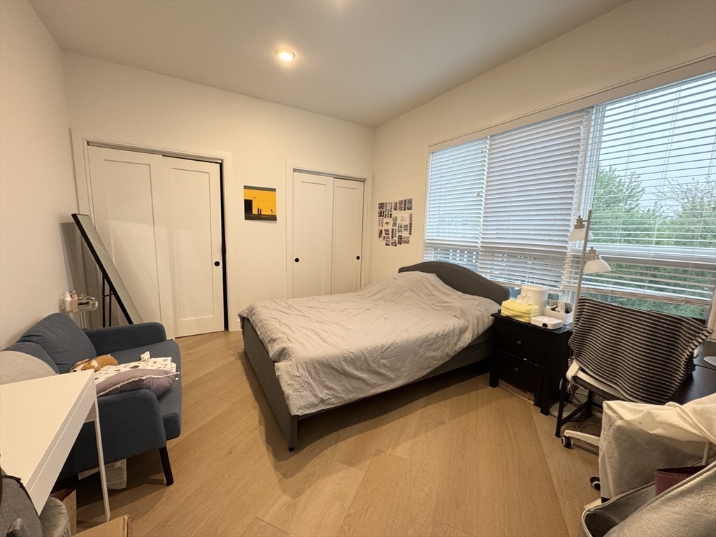 33 Ward Street, Unit 12 Boston, MA 02127 - Photo 8 of 19 a bedroom with a bed and wooden floor