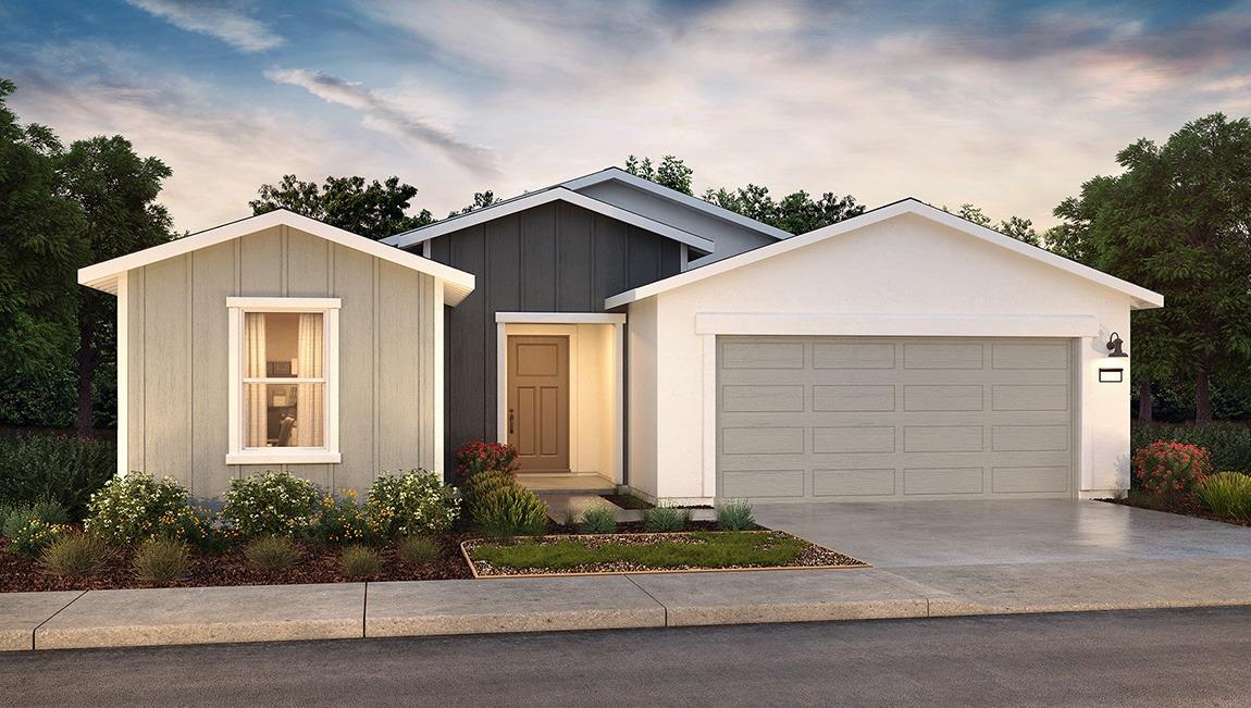 1553 Seneca Drive, Unit 86 Madera, CA 93637 - Photo 1 of 21 a front view of a house with a yard and garage