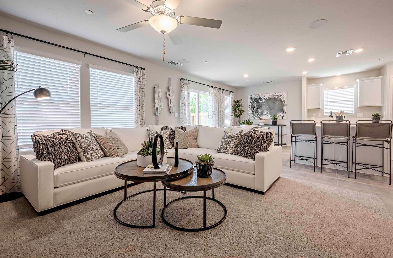 1553 Seneca Drive, Unit 86 Madera, CA 93637 - Photo 8 of 21 a living room with furniture a ceiling fan and a window