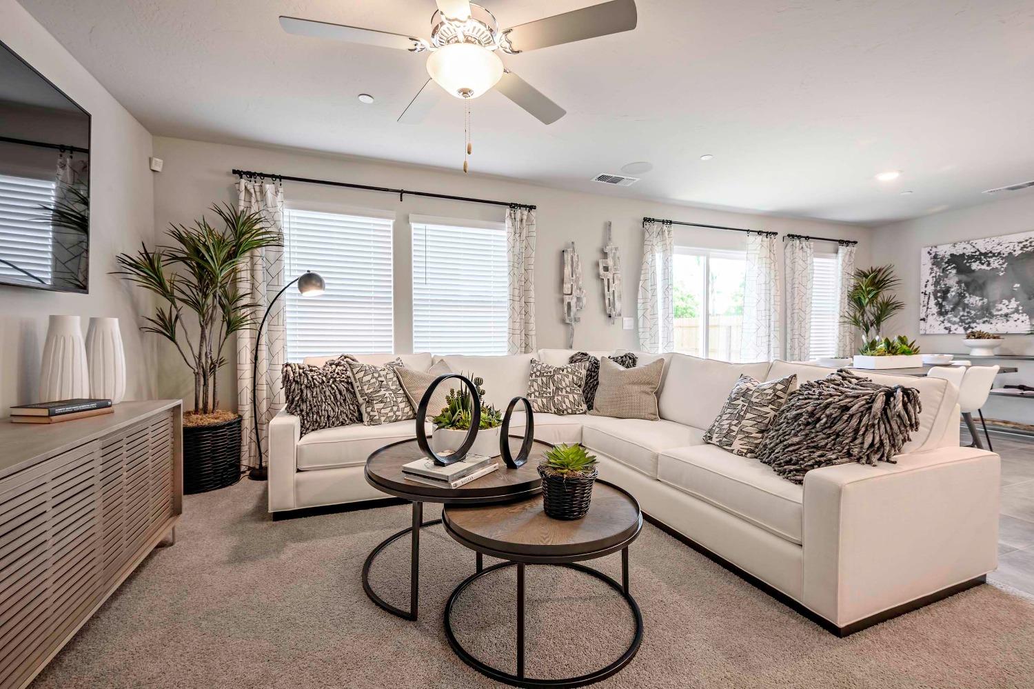 1553 Seneca Drive, Unit 86 Madera, CA 93637 - Photo 9 of 21 a living room with furniture and a large window