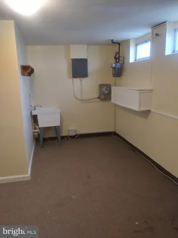 a view of a room with a bed