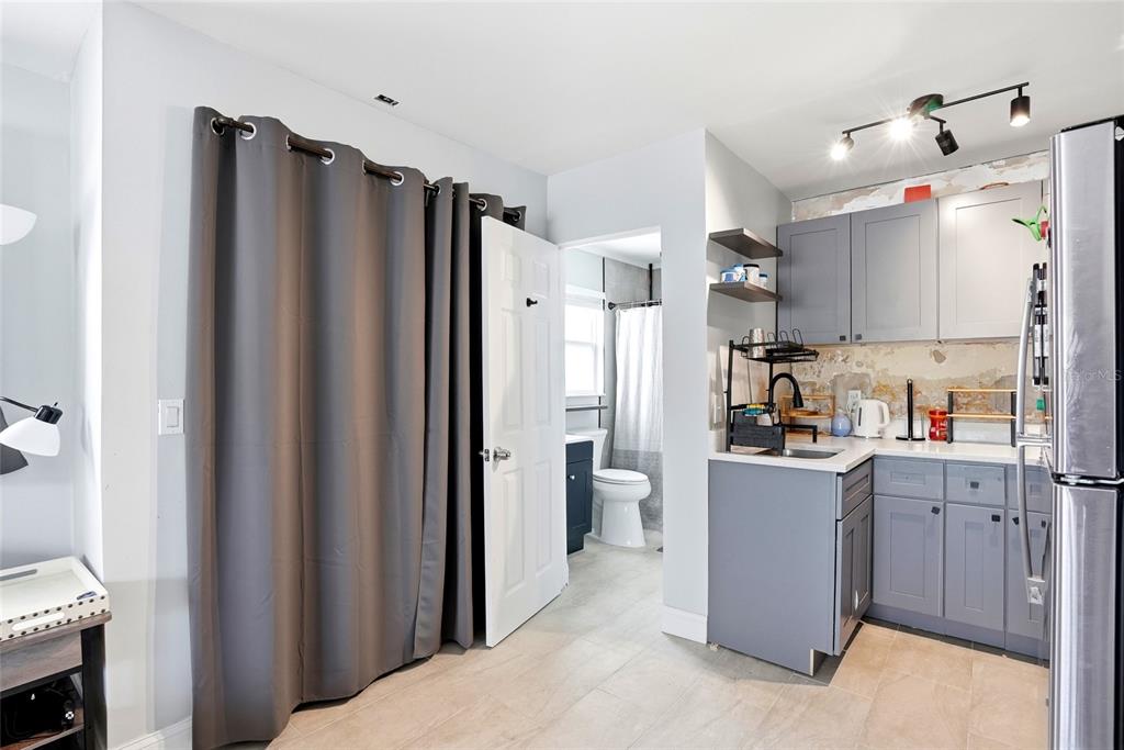 2311 Bay Boulevard Indian Rocks Beach, FL 33785 - Photo 61 of 80 a kitchen with stainless steel appliances granite countertop a refrigerator and a sink