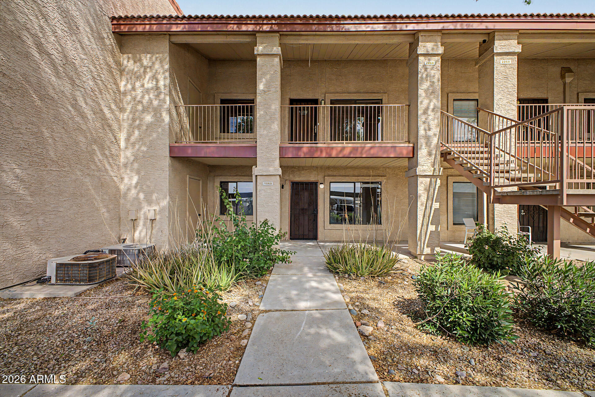 1440 North Idaho Road, Unit 1060 Apache Junction, AZ 85119 - Photo 1 of 16 a front view of a house