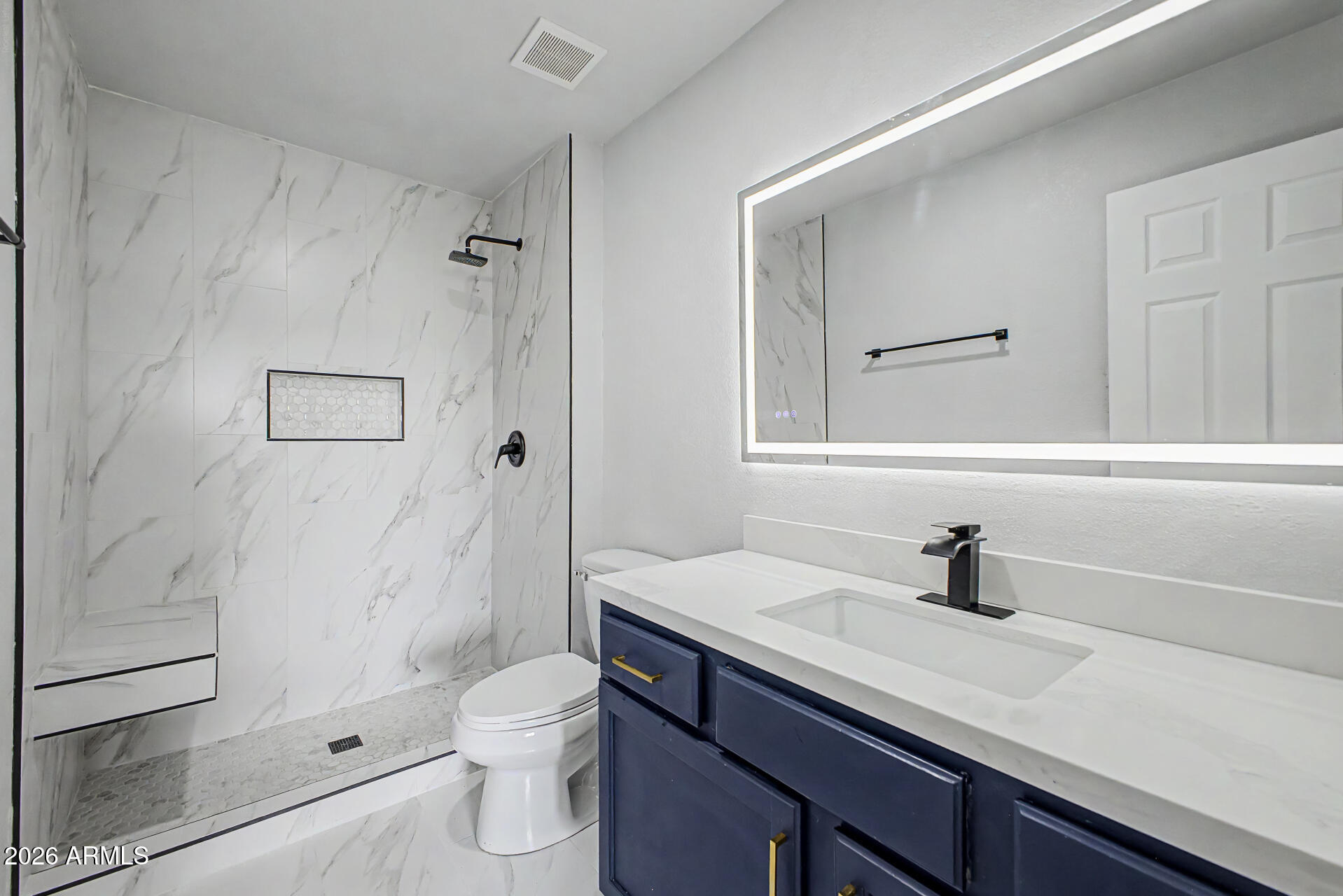 1440 North Idaho Road, Unit 1060 Apache Junction, AZ 85119 - Photo 15 of 16 a bathroom with a sink a toilet and shower