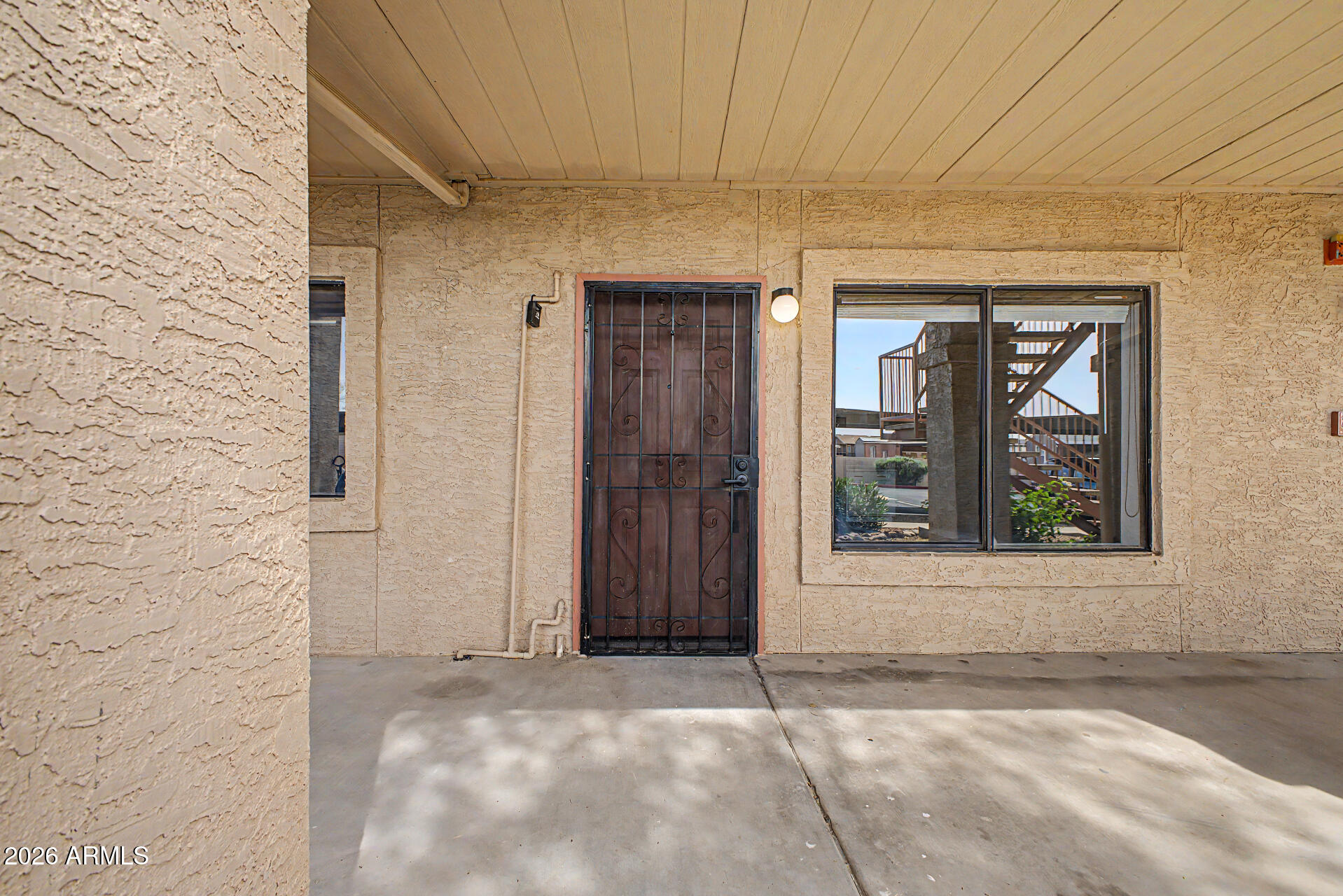 1440 North Idaho Road, Unit 1060 Apache Junction, AZ 85119 - Photo 7 of 16 a view of a door and a window