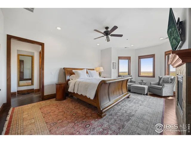 a bedroom with a bed a couch and dresser