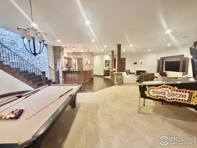 a living room with furniture flat screen tv and a table