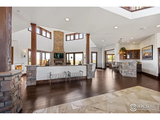 a lobby with furniture and floor to ceiling windows