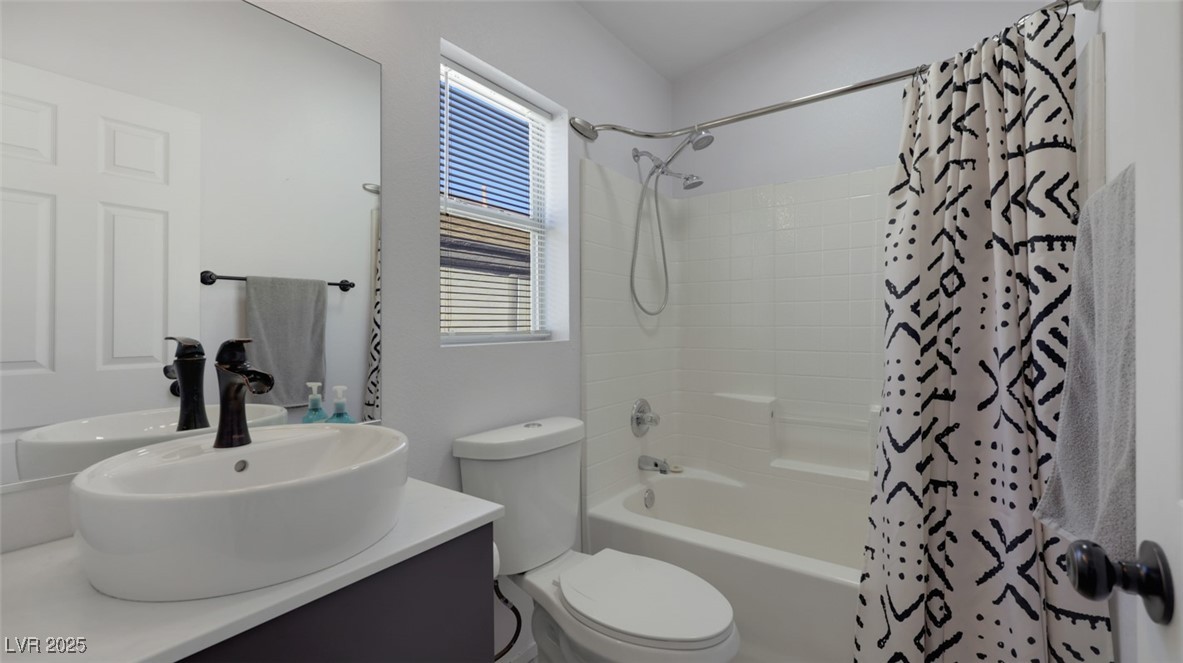 5940 High Steed Street, Unit 101 Henderson, NV 89011 - Photo 23 of 30 Bathroom with shower / bath combo and vanity