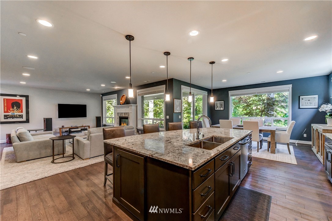 1607 233rd Street Southeast Bothell, WA 98021 - Photo 11 of 36 a kitchen with a stove center island and couches