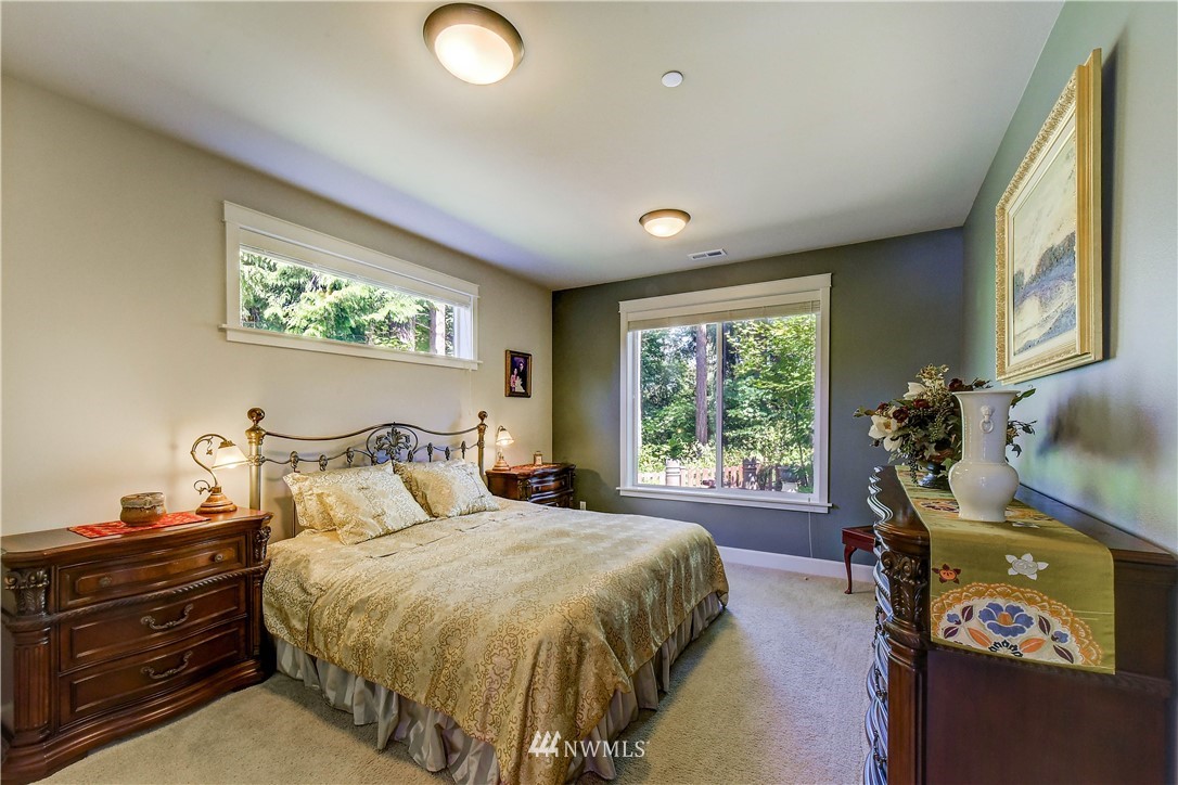 1607 233rd Street Southeast Bothell, WA 98021 - Photo 15 of 36 a bed room with a bed and a window