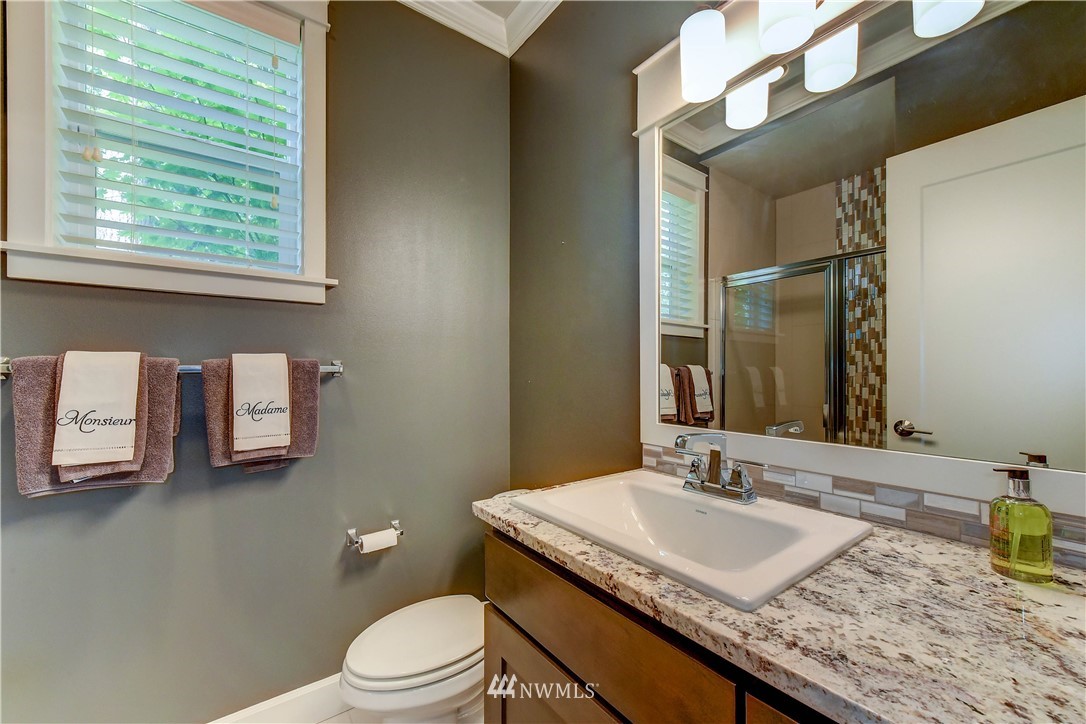1607 233rd Street Southeast Bothell, WA 98021 - Photo 16 of 36 a bathroom with a granite countertop sink and a toilet