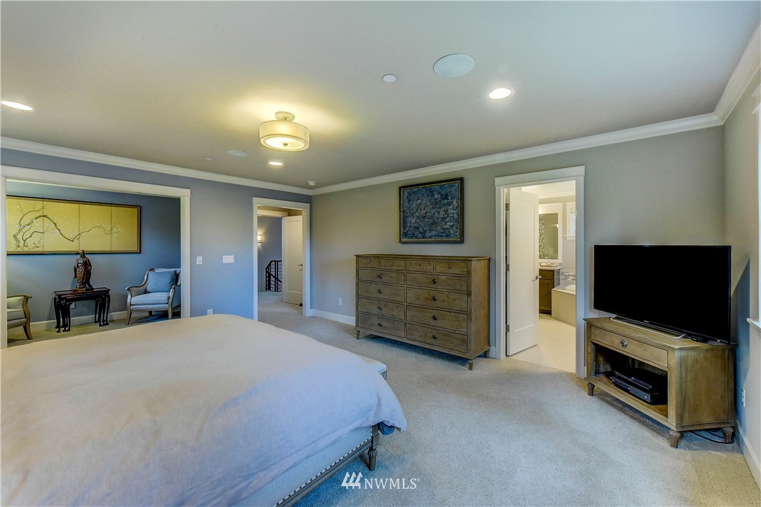 1607 233rd Street Southeast Bothell, WA 98021 - Photo 18 of 36 a bedroom with a bed and a television in it