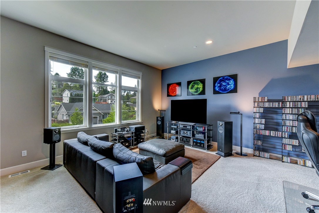 1607 233rd Street Southeast Bothell, WA 98021 - Photo 29 of 36 a living room with furniture and a flat screen tv