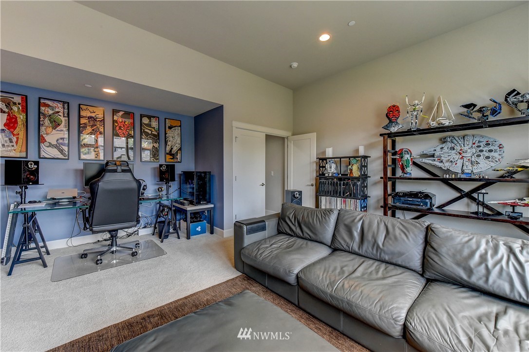 1607 233rd Street Southeast Bothell, WA 98021 - Photo 30 of 36 a living room with furniture and a flat screen tv