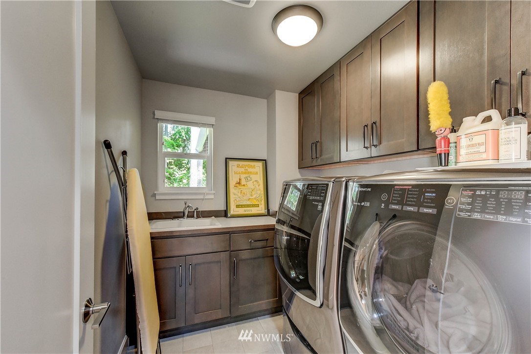 1607 233rd Street Southeast Bothell, WA 98021 - Photo 31 of 36 a kitchen with a sink and washing machine
