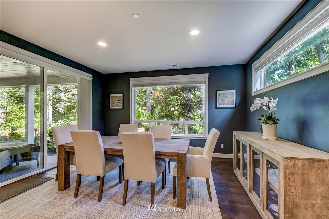 1607 233rd Street Southeast Bothell, WA 98021 - Photo 8 of 36 a view of a dining room with furniture window and wooden floor