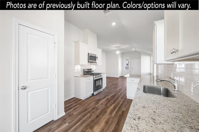 a view of kitchen and wooden floor