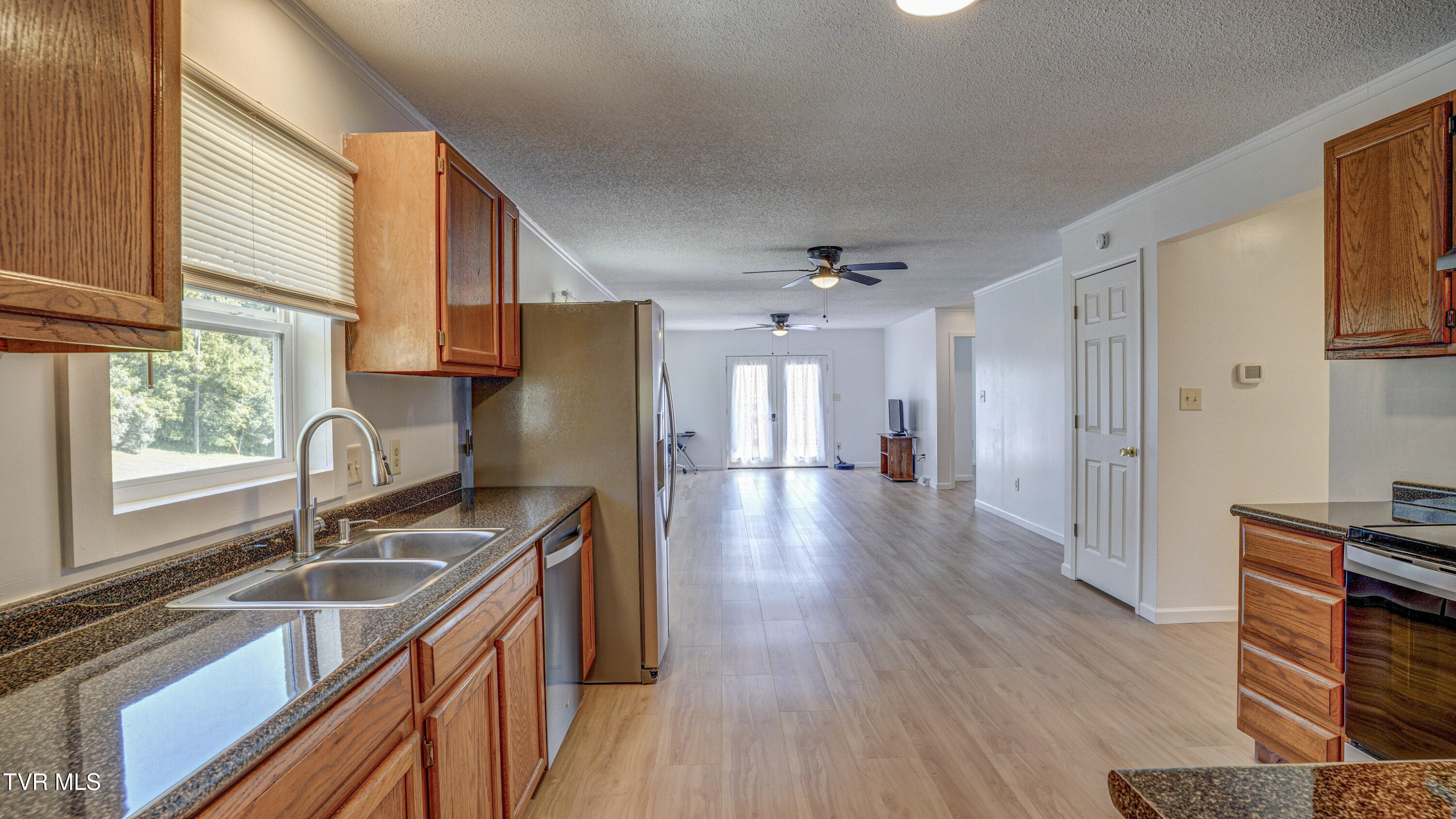 411 Culver Road Limestone, TN 37681 - Photo 22 of 58 Kitchen into dining & living areas
