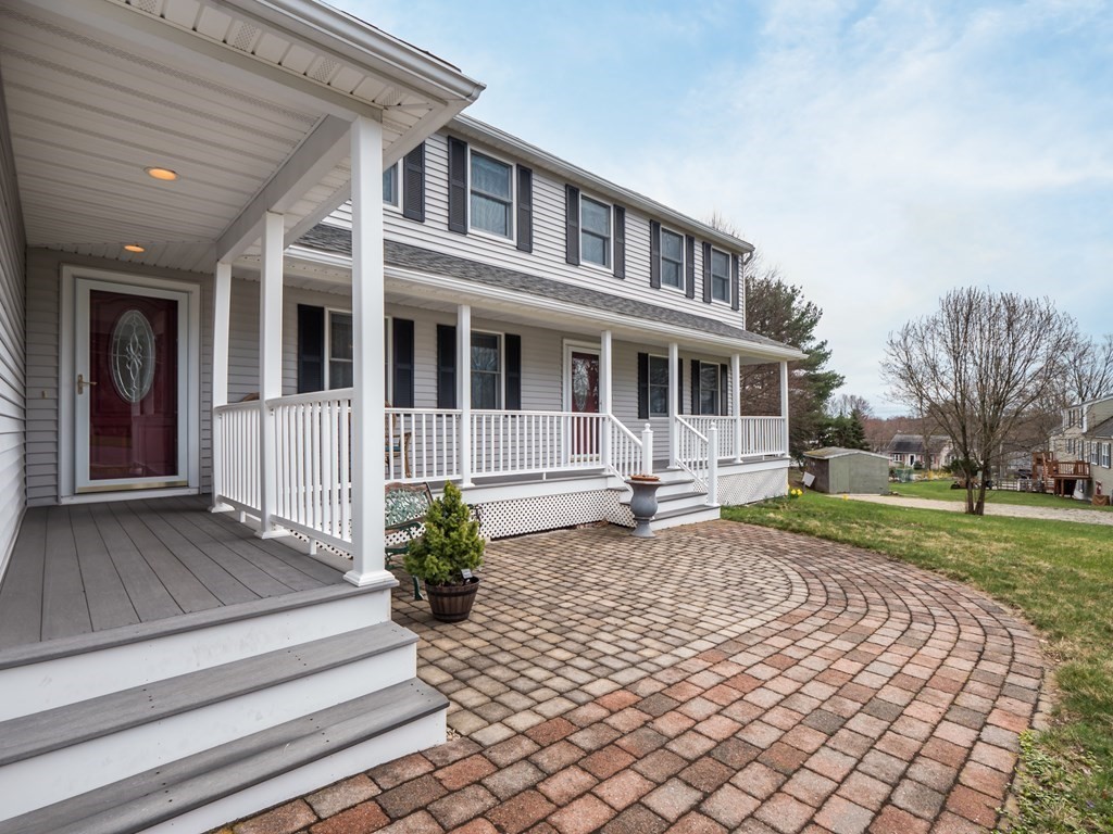 21 Partridge Road Dracut, MA 01826 - Photo 5 of 42 a front view of a house with a garden