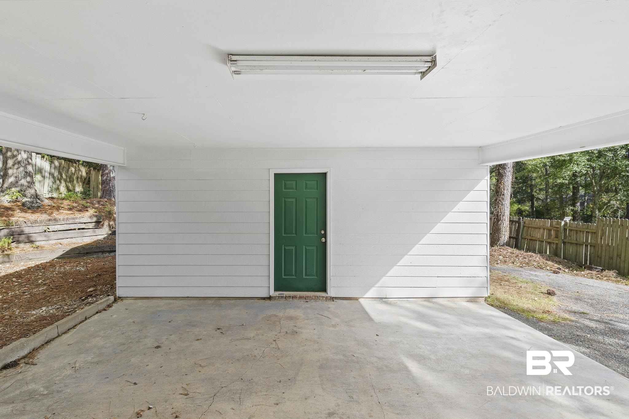 359 Ridgewood Drive Daphne, AL 36526 - Photo 49 of 73 Large storage area attached to carport
