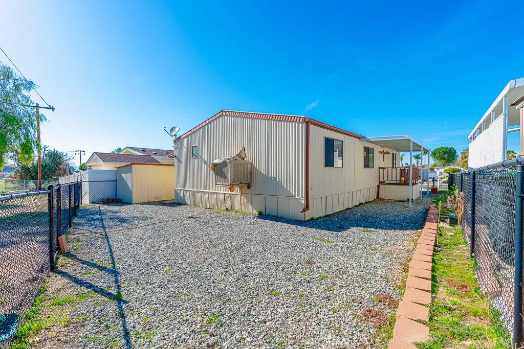 1700 South State Street, Unit 76 Hemet, CA 92543 - Photo 14 of 36 a view of a house with a yard