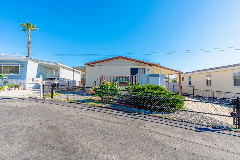 1700 South State Street, Unit 76 Hemet, CA 92543 - Photo 8 of 36 a house view with a garden space