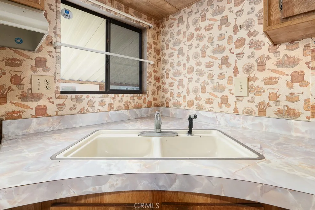 1700 South State Street, Unit 76 Hemet, CA 92543 - Photo 10 of 36 a bathroom with a granite countertop sink and a bathtub