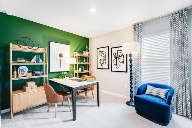 a living room with furniture and book shelf