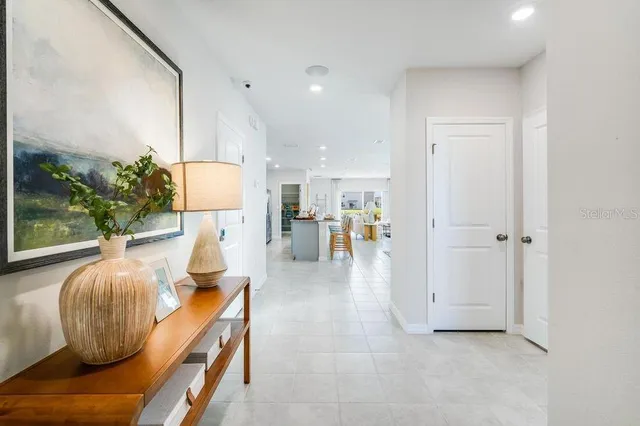 a living room with furniture a wooden floor and a window