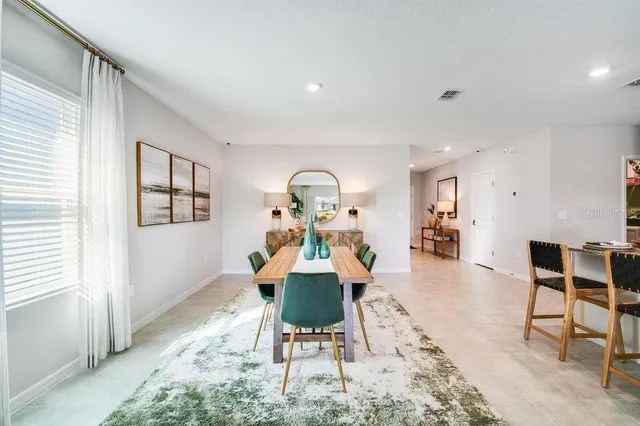 a view of a dining room with furniture