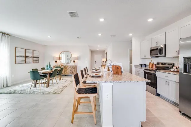 a group of people sitting in a living room