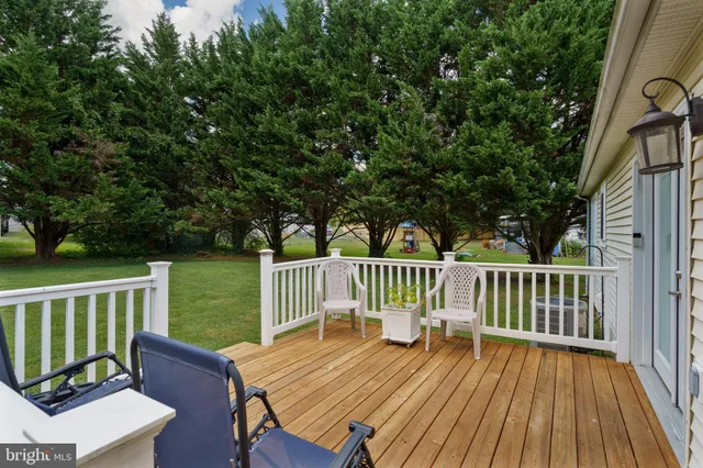a view of a wooden deck with a bench