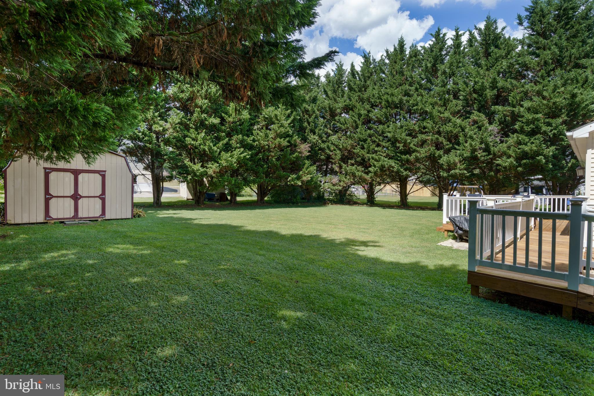 472 Upshur Drive Inwood, WV 25428 - Photo 23 of 26 a view of a garden with a bench