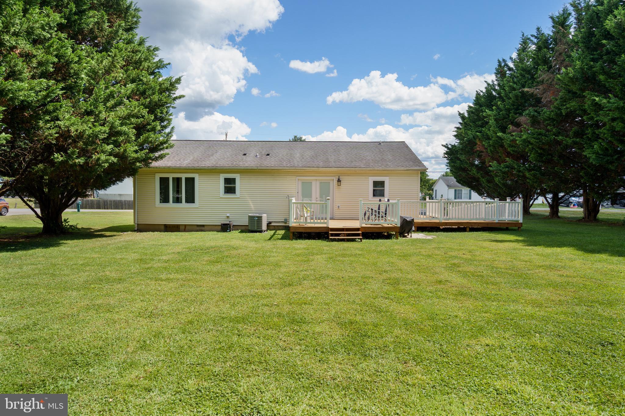 472 Upshur Drive Inwood, WV 25428 - Photo 24 of 26 a front view of a house with a garden