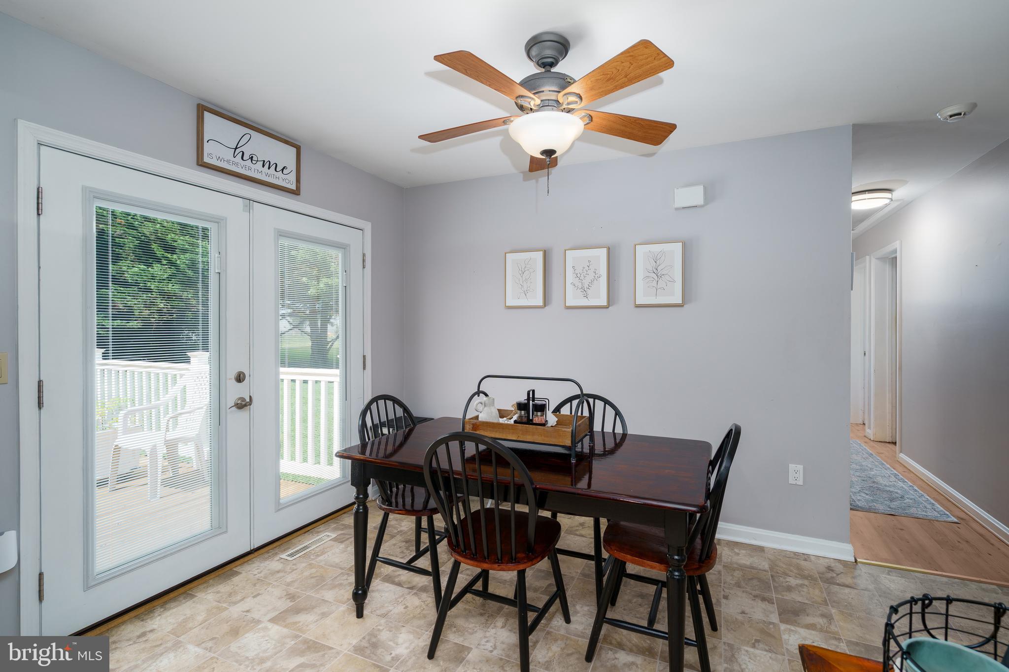 472 Upshur Drive Inwood, WV 25428 - Photo 7 of 26 a view of a dining room with furniture and a large window