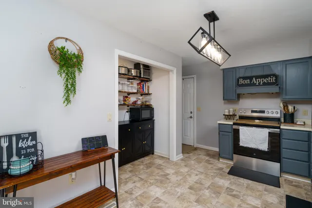 a view of workspace with window and cabinet