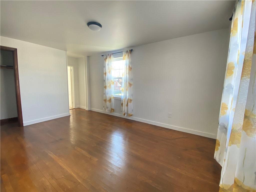 380 Vanadium Road Pittsburgh, PA 15243 - Photo 14 of 23 an empty room with wooden floor and windows