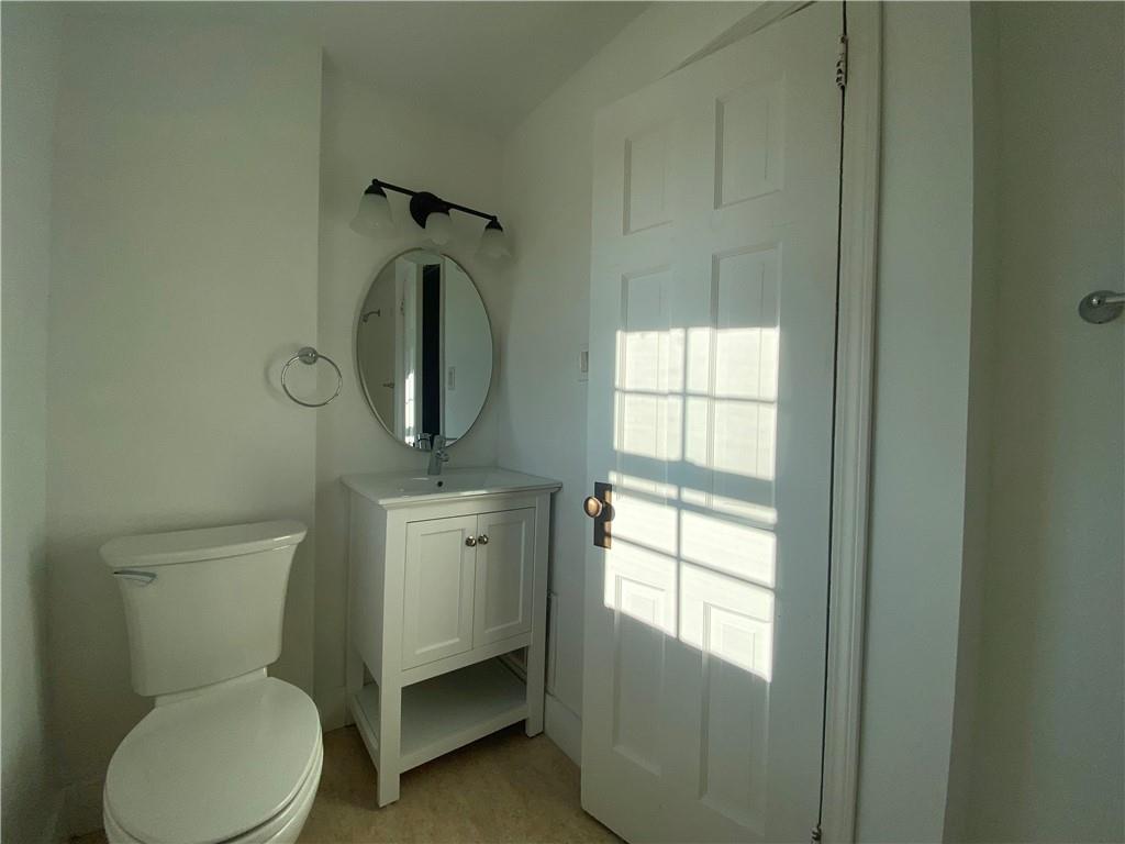 380 Vanadium Road Pittsburgh, PA 15243 - Photo 20 of 23 a bathroom with a toilet sink and mirror