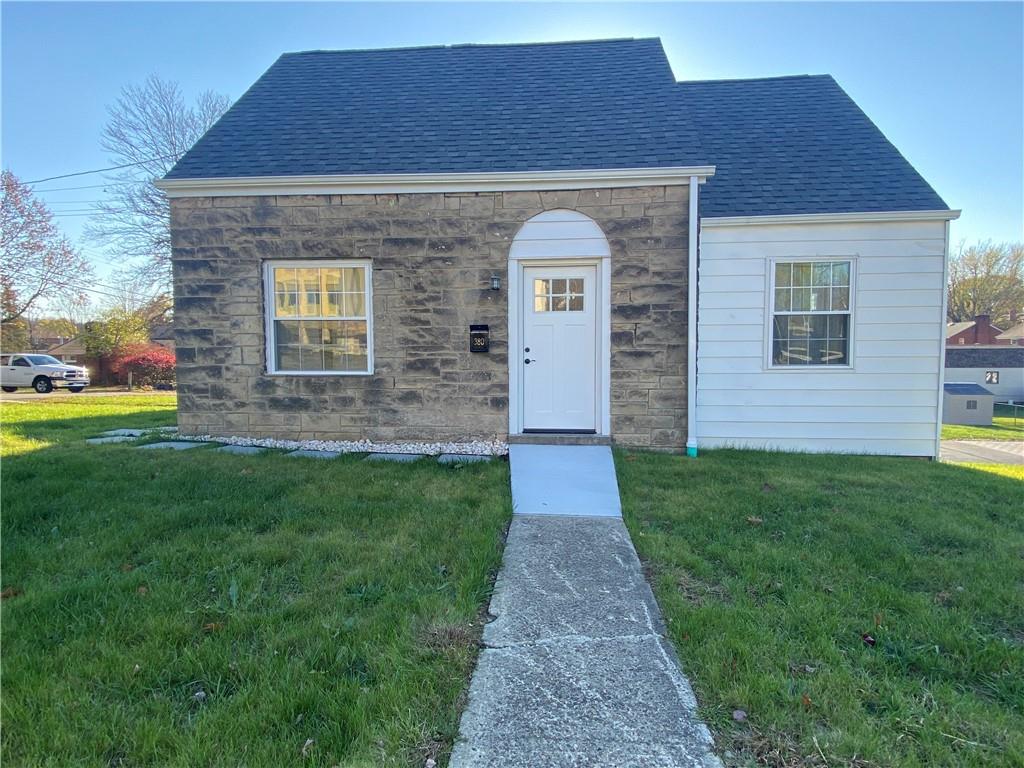 380 Vanadium Road Pittsburgh, PA 15243 - Photo 2 of 23 a front view of a house with a garden